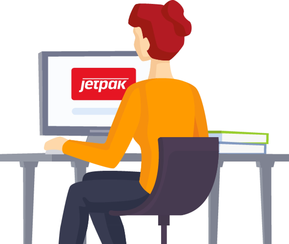 Kvinna med orange tröja och rött hår sitter vid en dator med Jetpak logo på skärmen