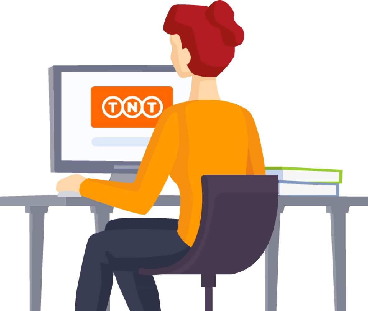 Kvinna med orange tröja och rött hår sitter vid en dator med TNT logo på skärmen